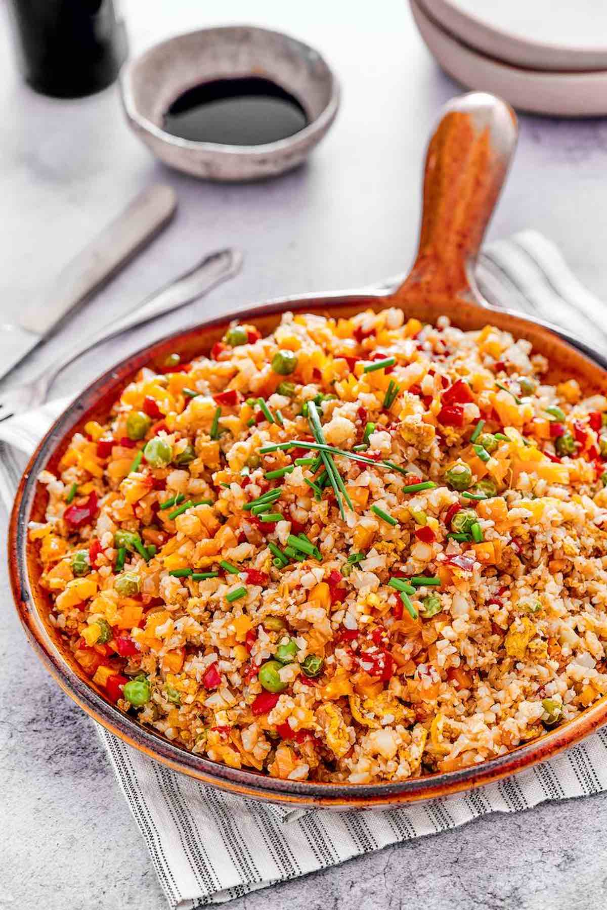 cauliflower fried rice in a serving dish.