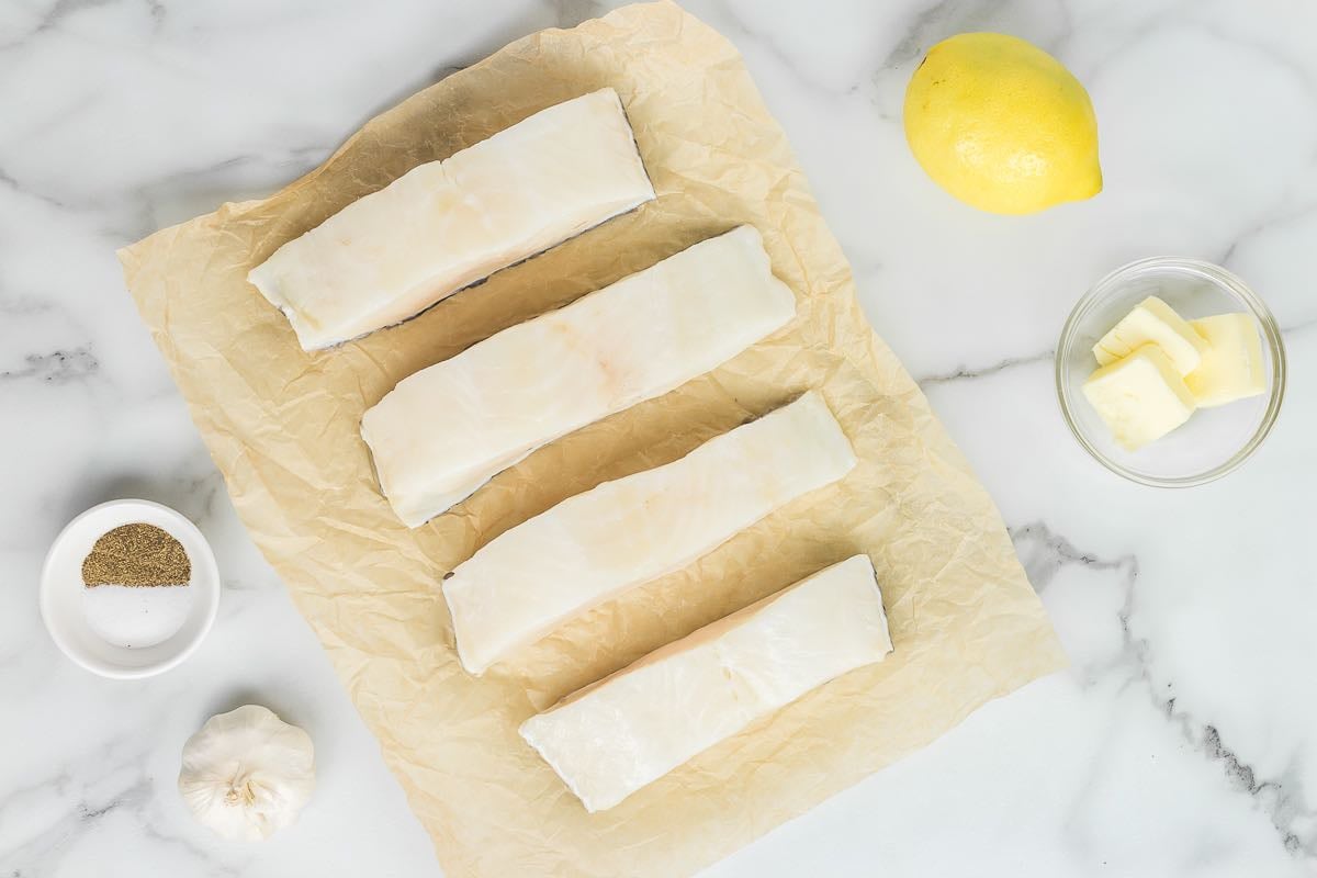 raw chilean sea bass fillets with salt and pepper.