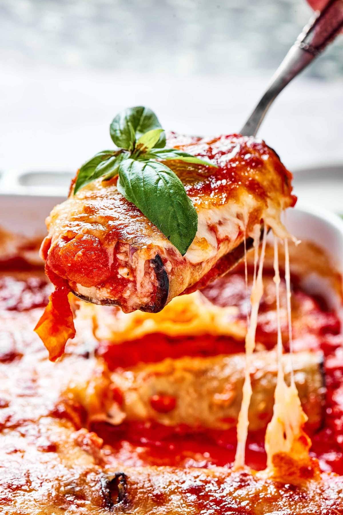 baked eggplant rollatini with fresh basil.