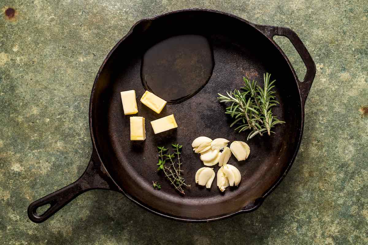 butter, garlic cloves, and herbs.
