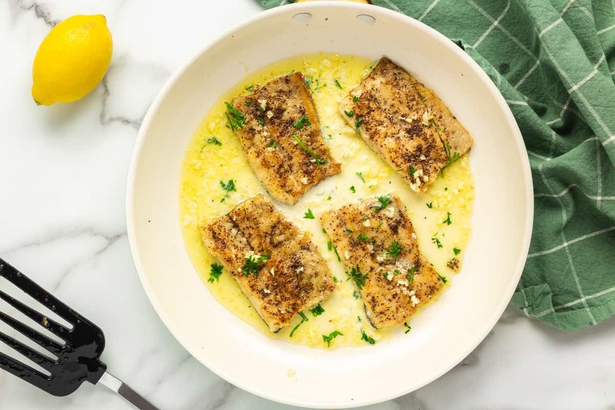 pan-seared rainbow trout fillets with garlic and butter.