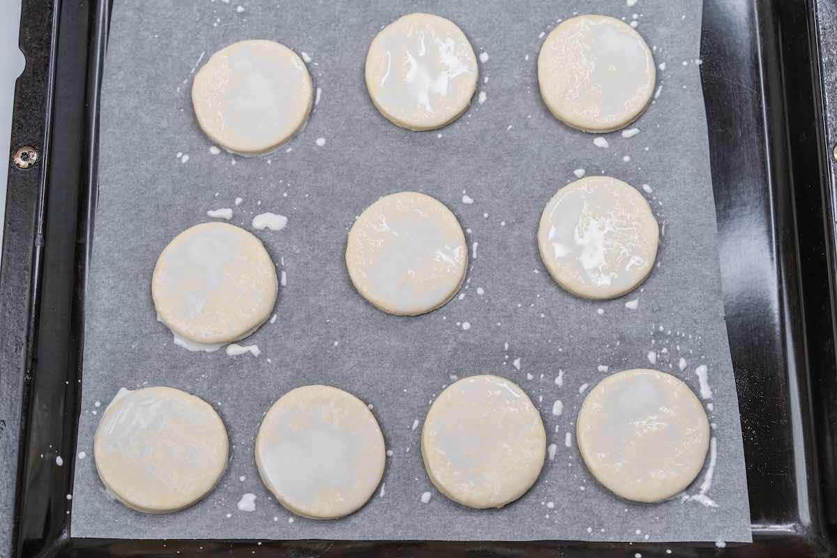 unbaked biscuits with heavy cream brushed on top.