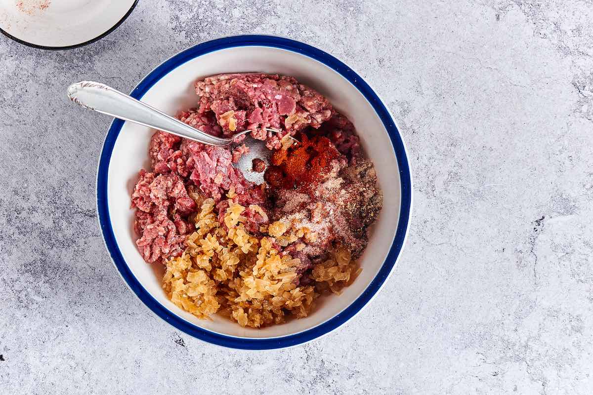 hamburger patty ingredients in mixing bowl.