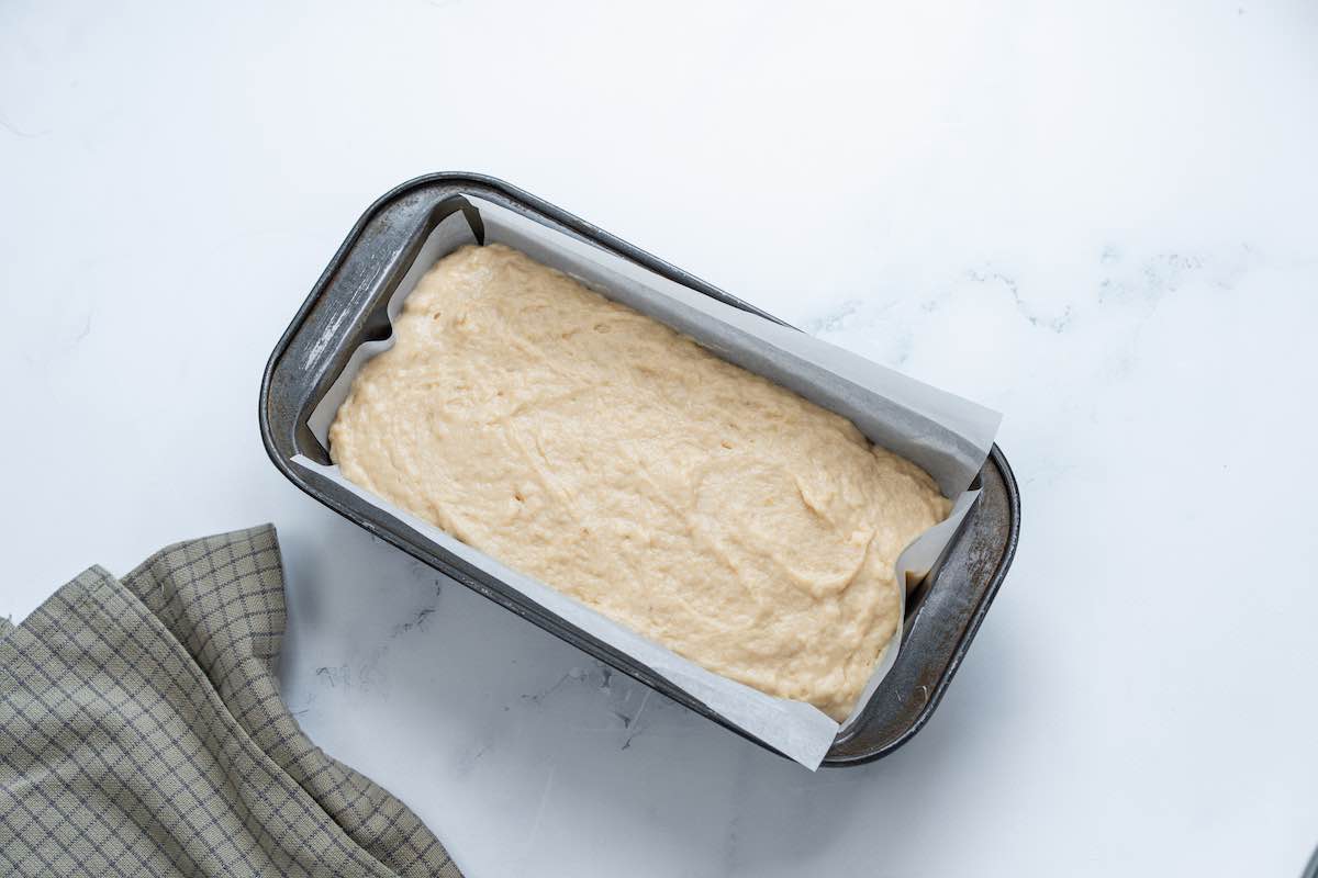 banana bread batter in a loaf pan.