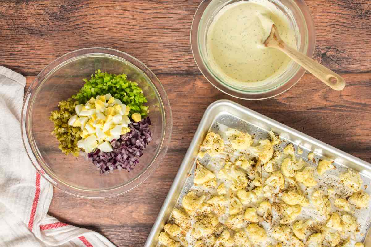 boiled eggs, celery, pickles, and red onion in a bowl.