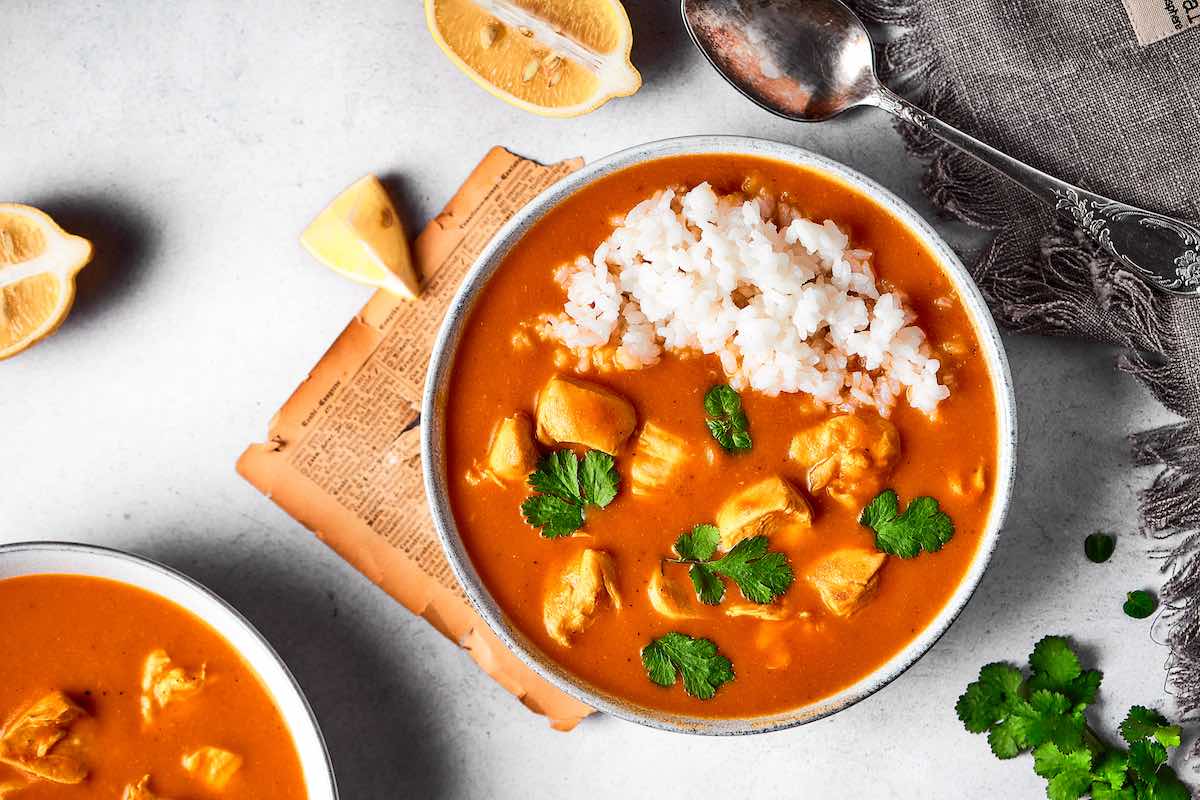 bowl of coconut chicken curry with white rice.