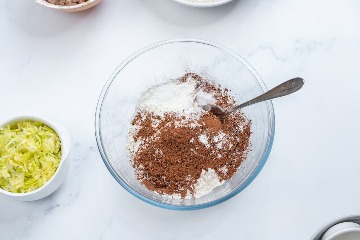 oat flour, cocoa powder, arrowroot powder, baking powder, and baking soda in a bowl.