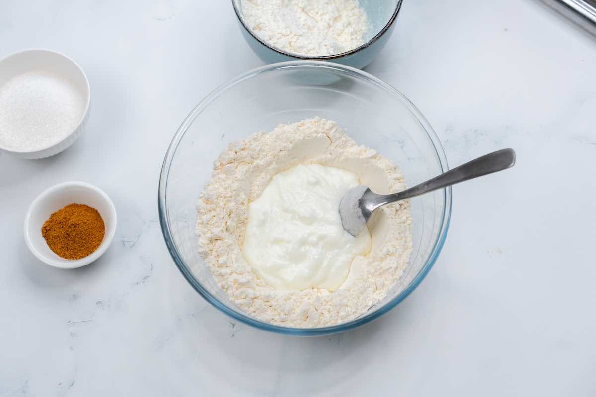 flour and yogurt in a mixing bowl.