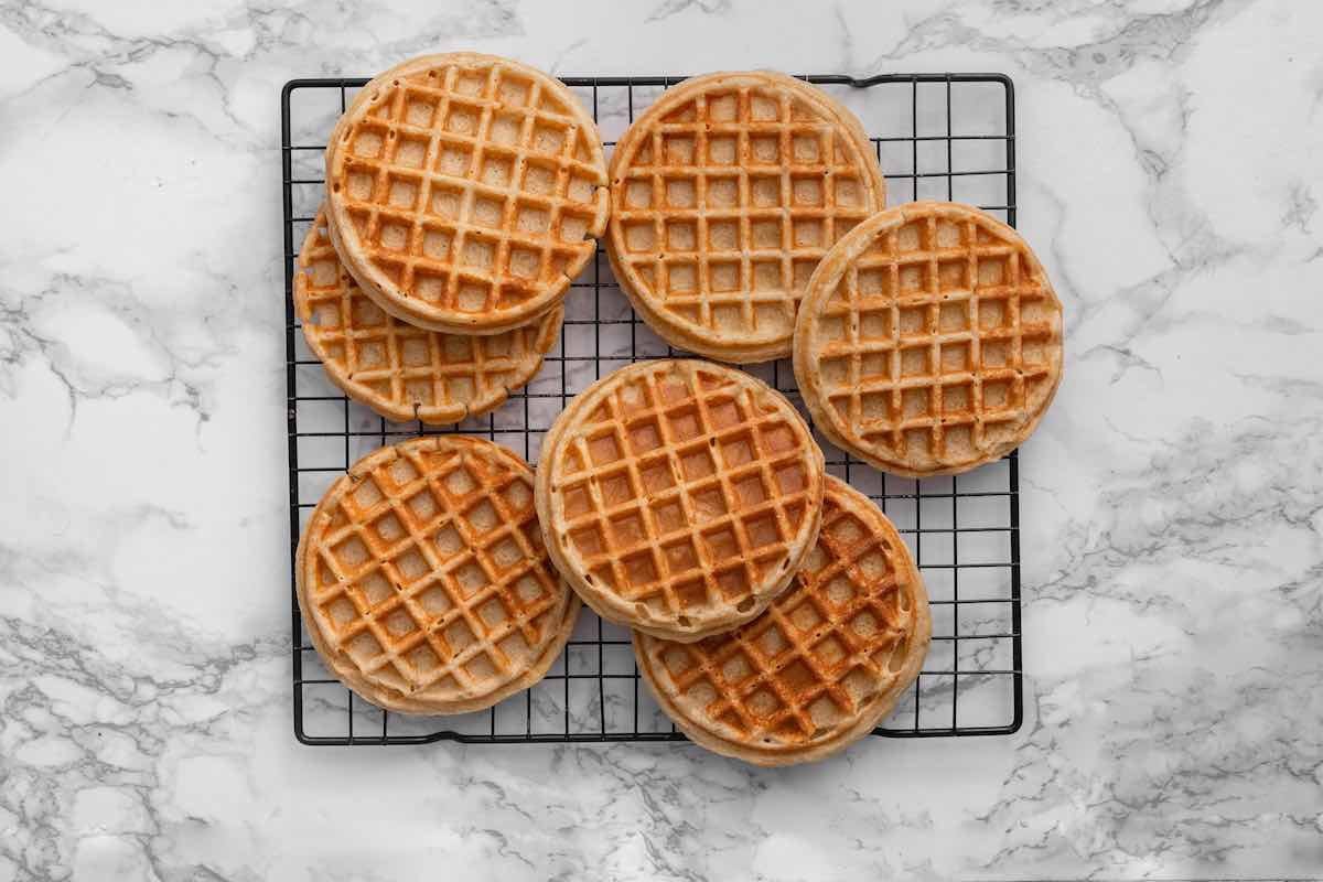 crispy cottage cheese waffles on a wire rack.