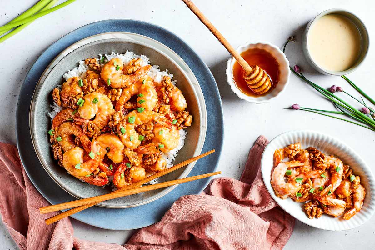 bowl of rice with honey walnut shrimp on top.