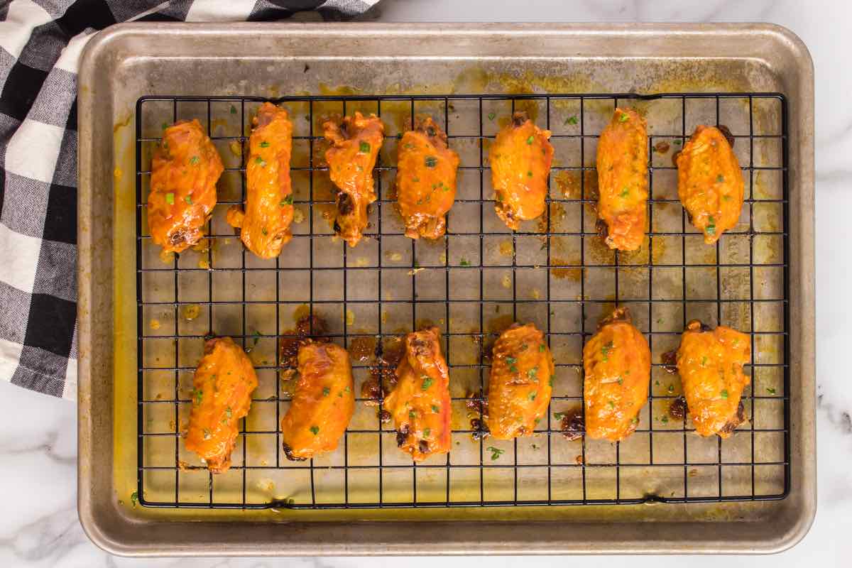 broiling chicken wings on a wire rack.