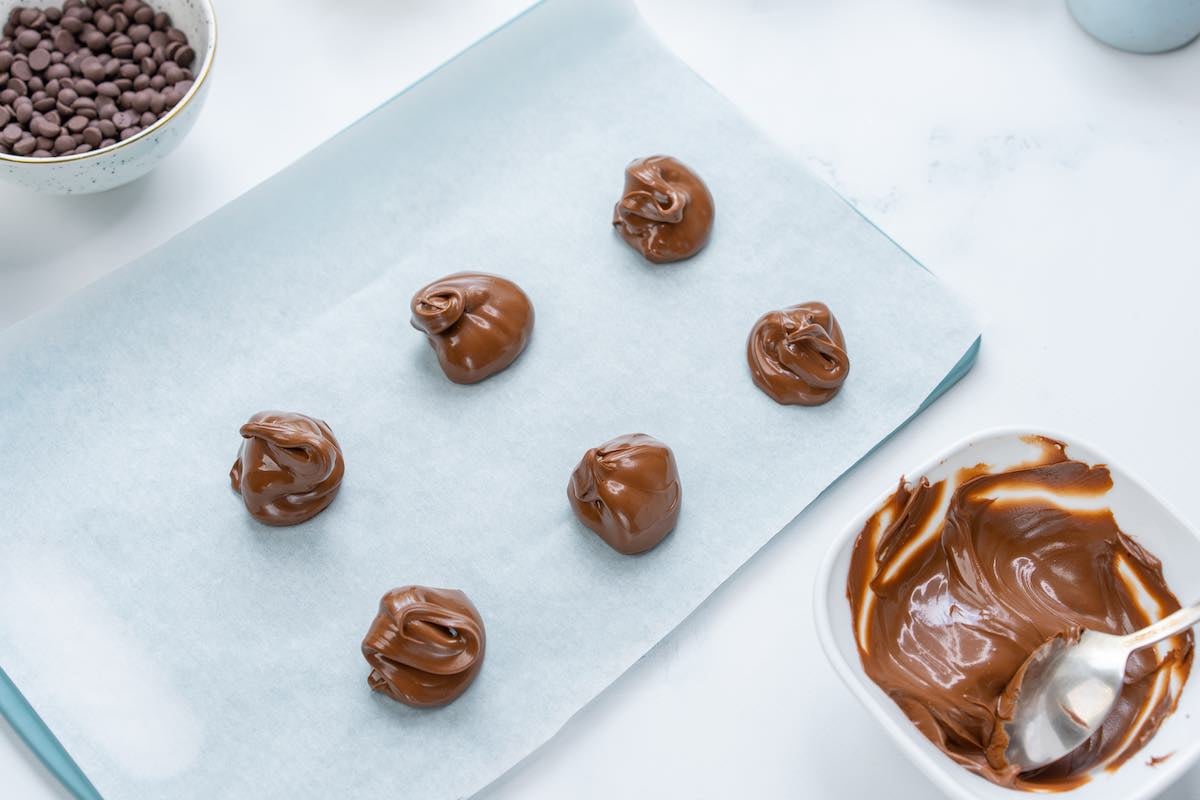 portions of Nutella on a baking sheet.