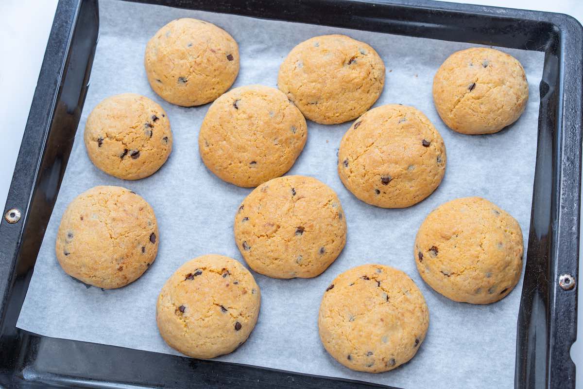 baked Nutella stuffed cookies on a baking sheet.