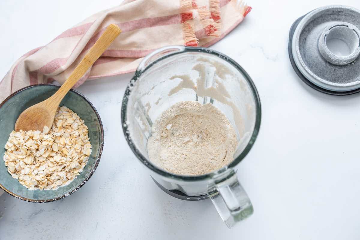blender with oat flour in it.