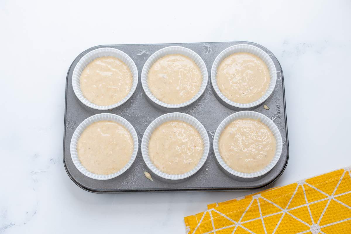 muffin batter in a muffin tin.