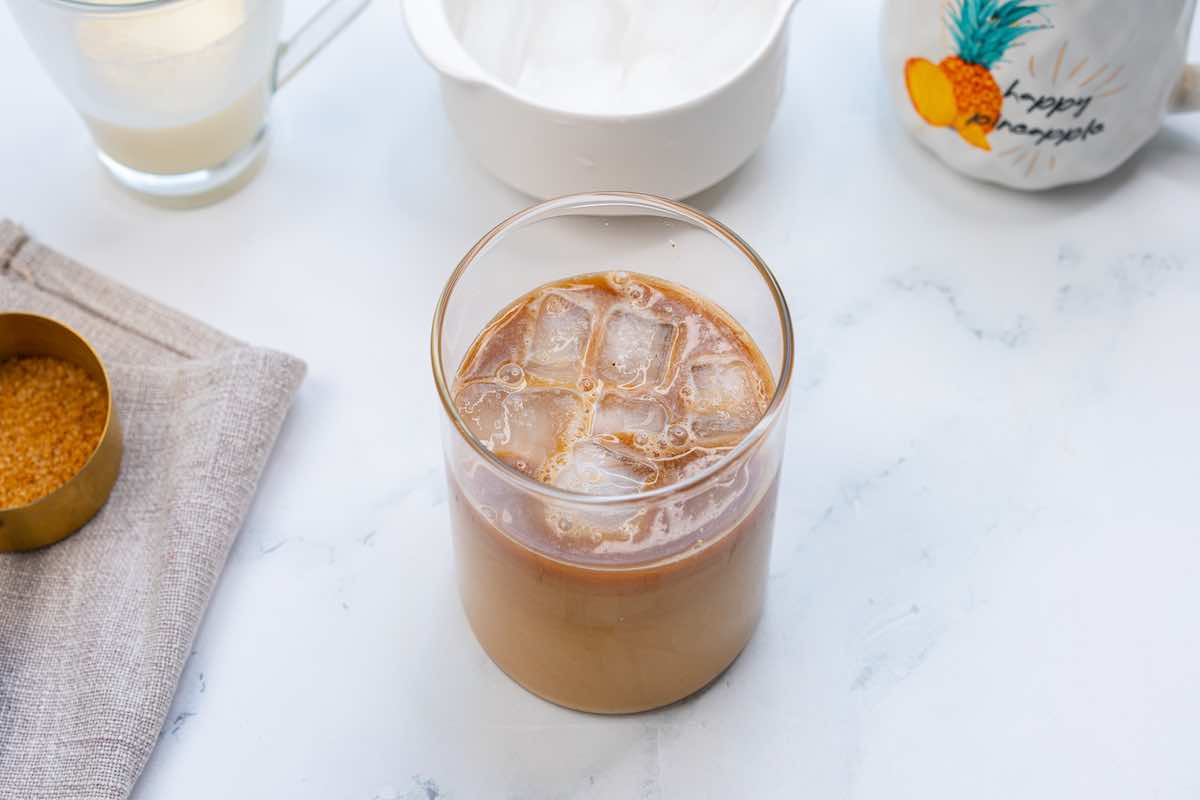 protein shake added to iced coffee in a glass.