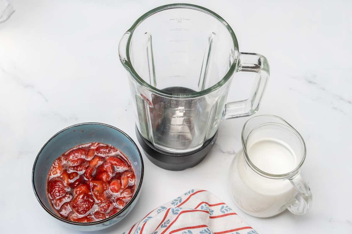 sieved strawberry syrup in a bowl.