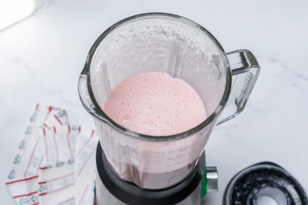 blended milk with strawberry syrup.