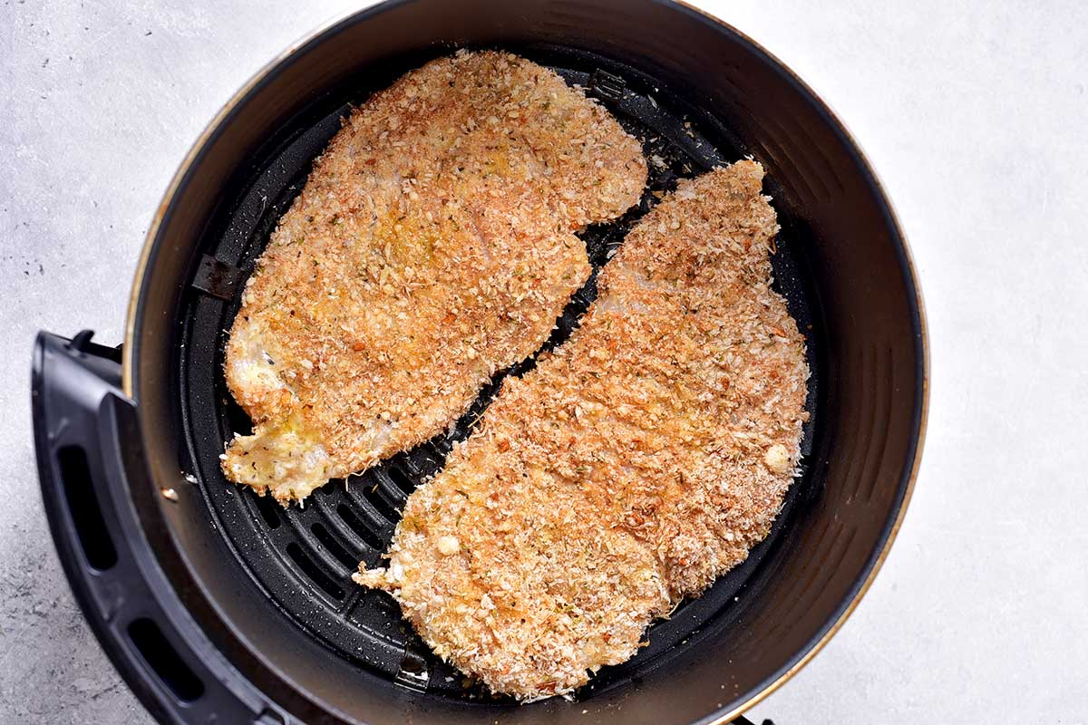 breaded raw chicken cutlets in the air fryer.