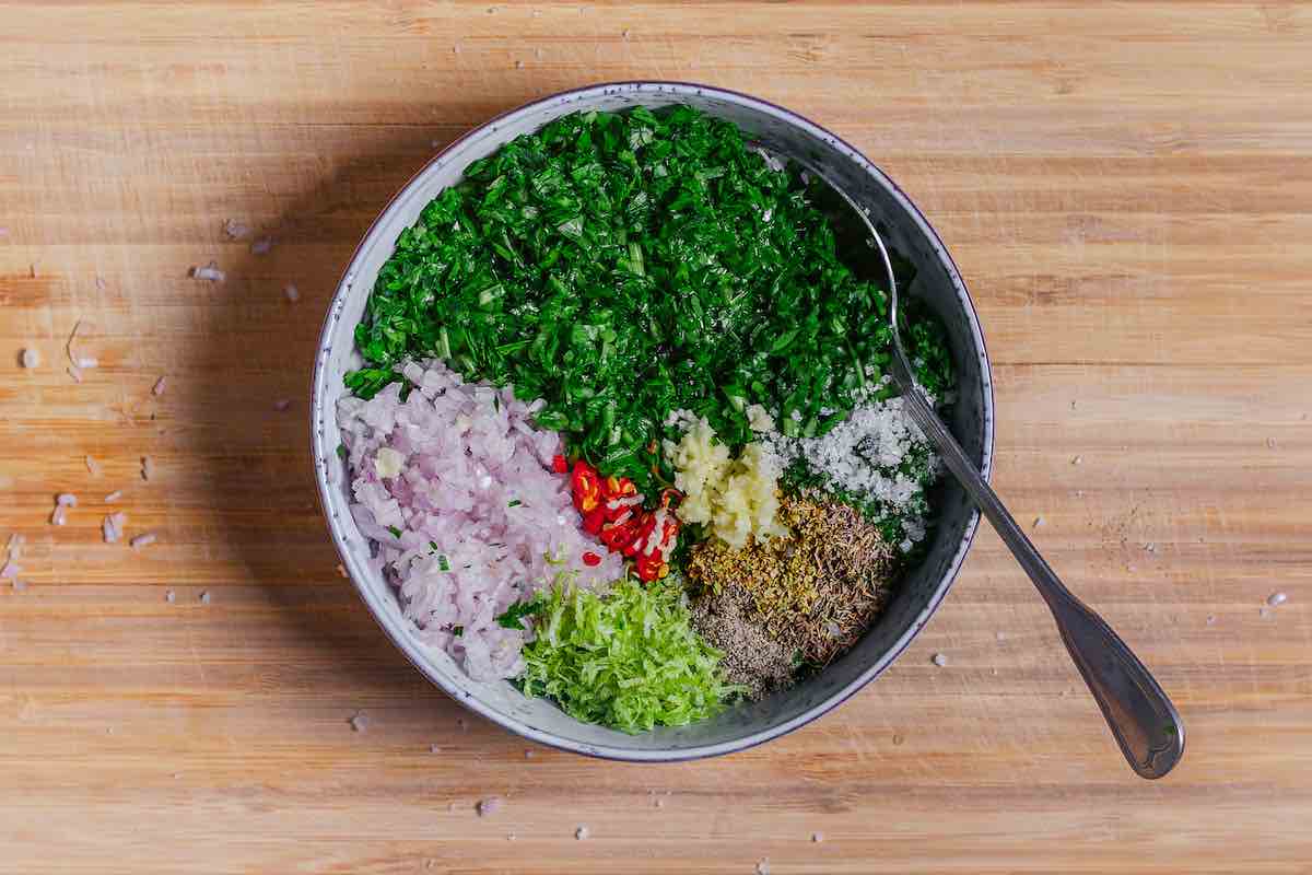 chimichurri sauce ingredients in a mixing bowl.