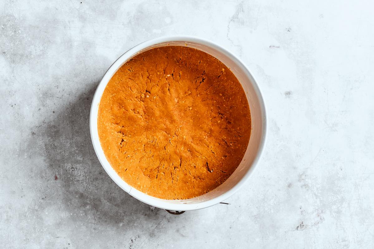 cheesecake crust pressed into a pan.