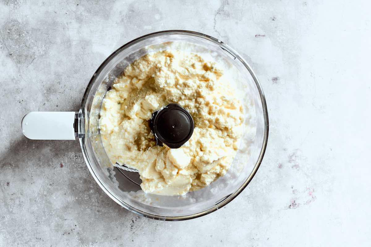 cottage cheese, Greek yogurt, and sugar in a blender.