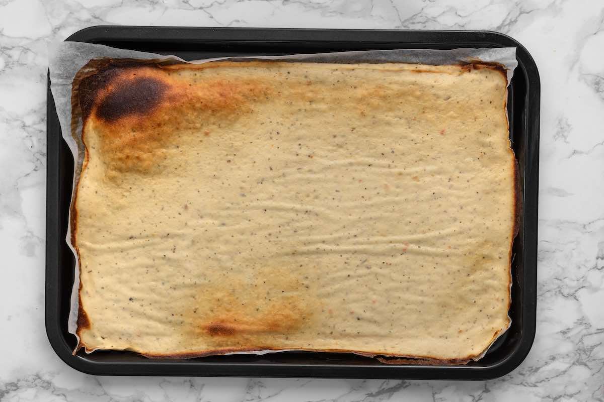 baked cottage cheese wraps on a baking sheet.