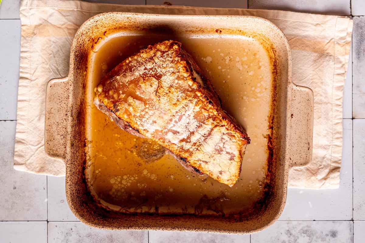 oven baked pork belly in a baking dish.