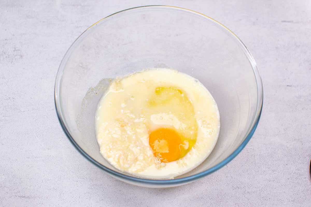melted mozzarella cheese, yogurt, and egg in a bowl.
