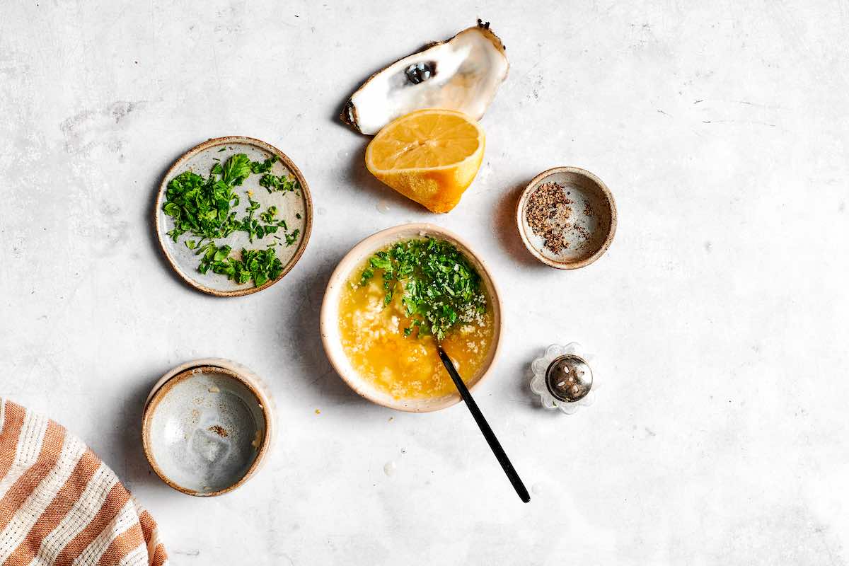 butter, garlic, parsley, and lemon juice in a bowl.