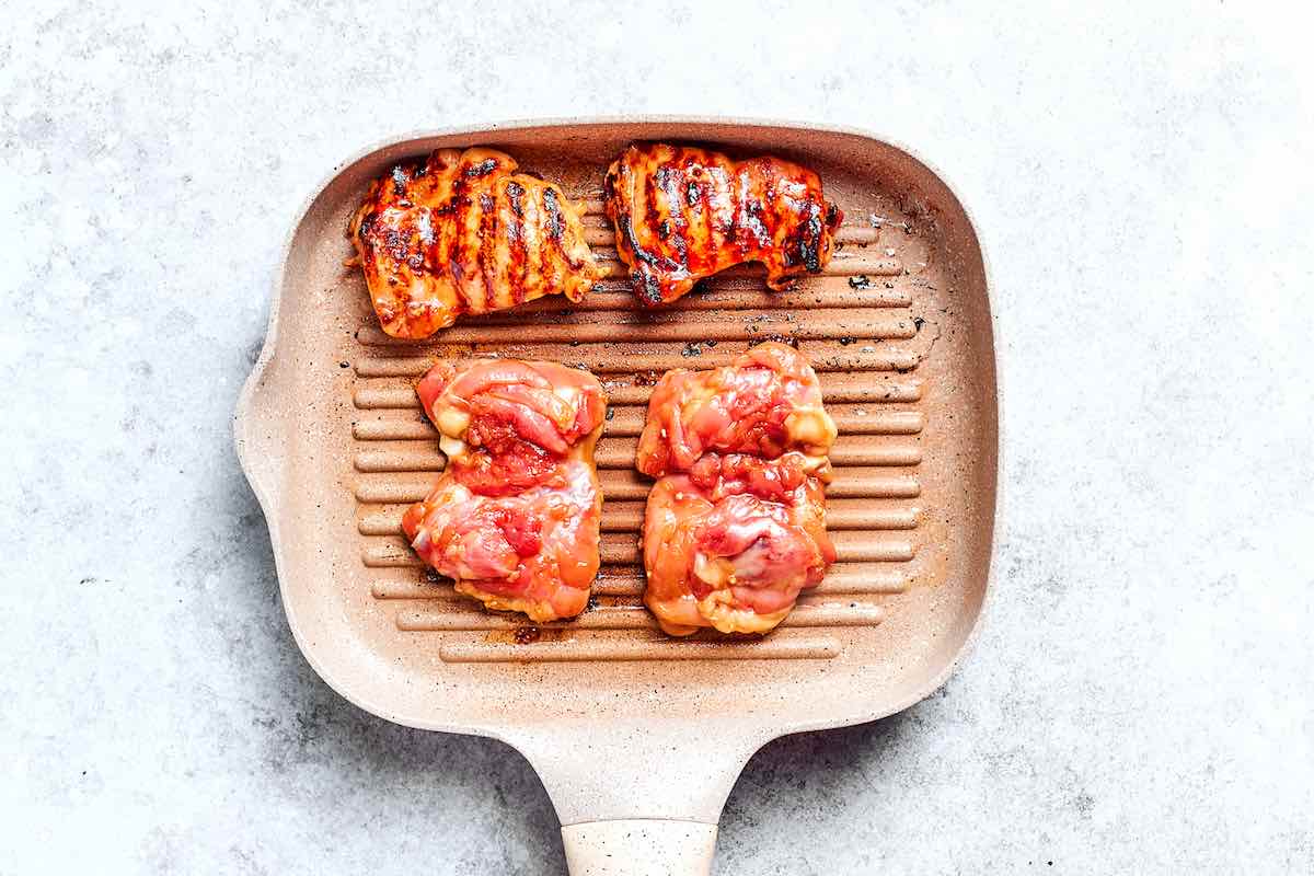 grilling marinated chicken thighs.