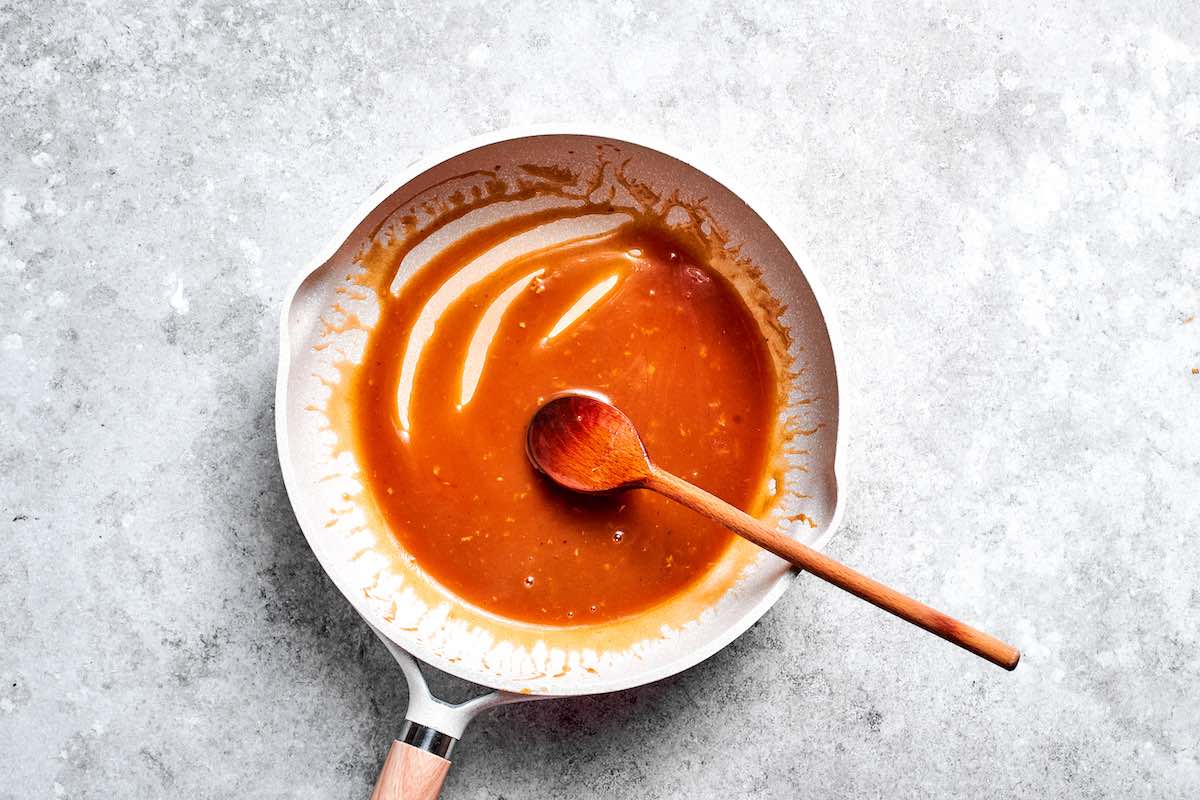 teriyaki sauce simmering in a skillet.