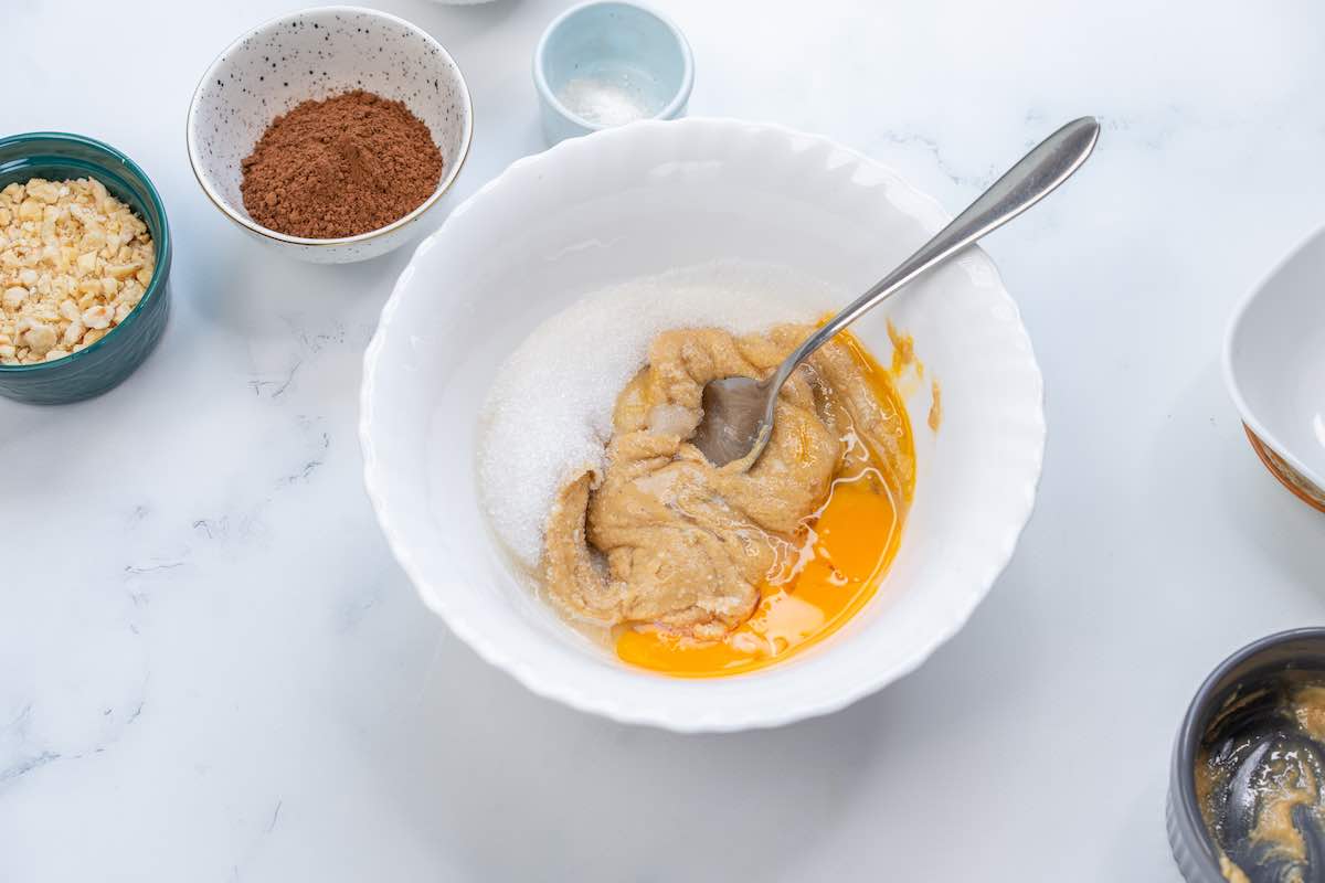 eggs, almond butter, and sugar in a bowl.