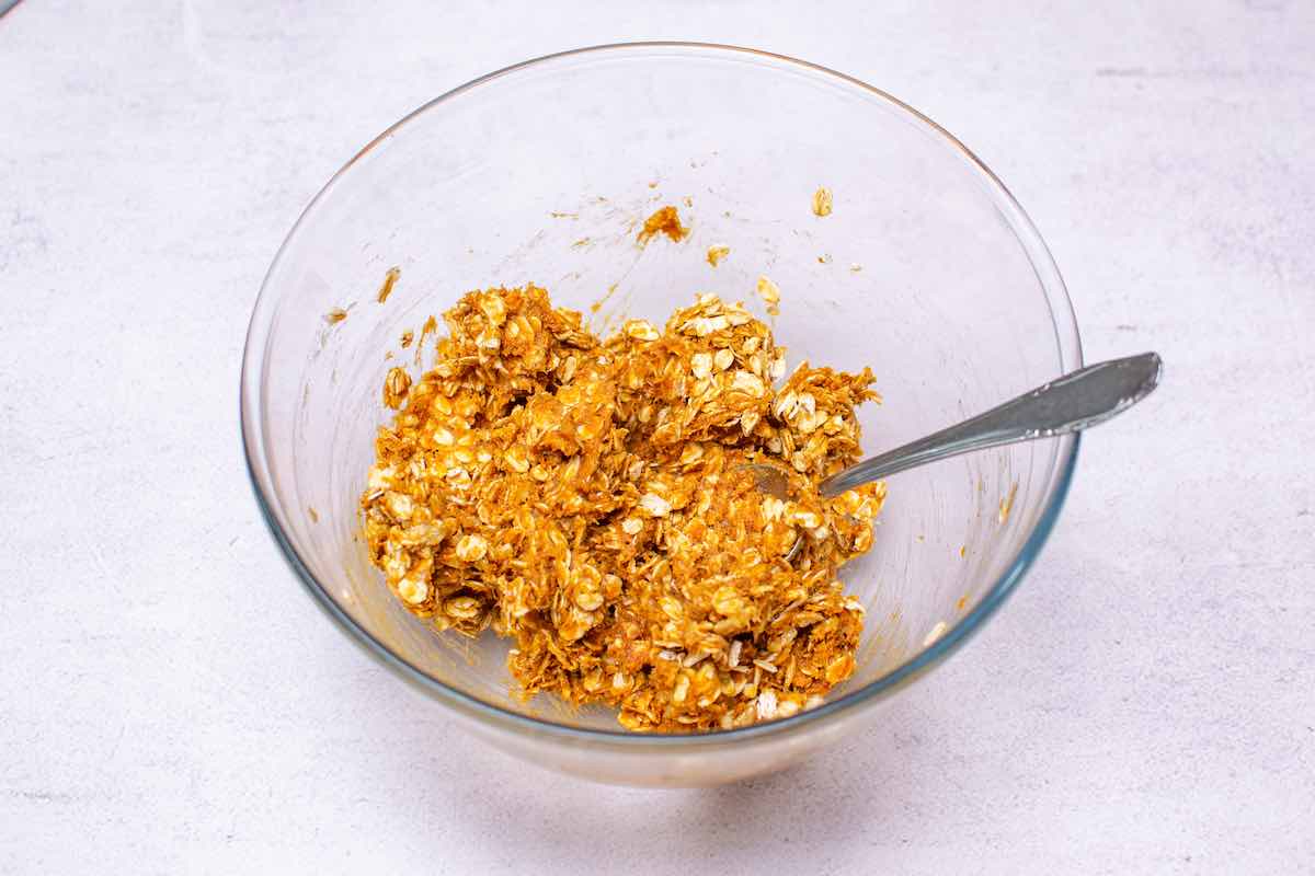oats, peanut butter, and banana mixed together in a bowl.