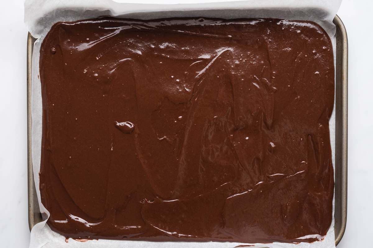 keto brownie batter spread in a baking dish.