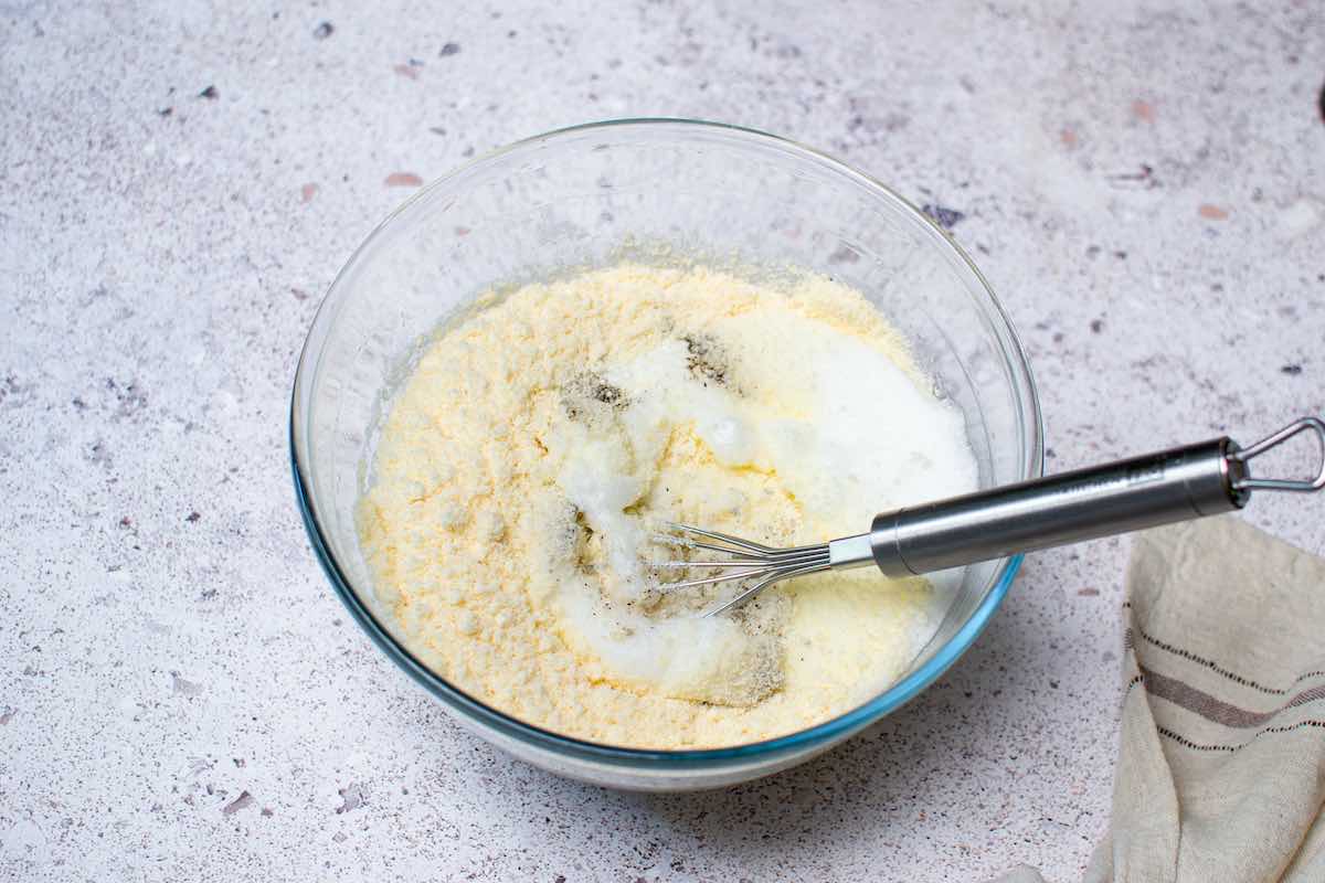 dry ingredients and whipped egg whites in a bowl.