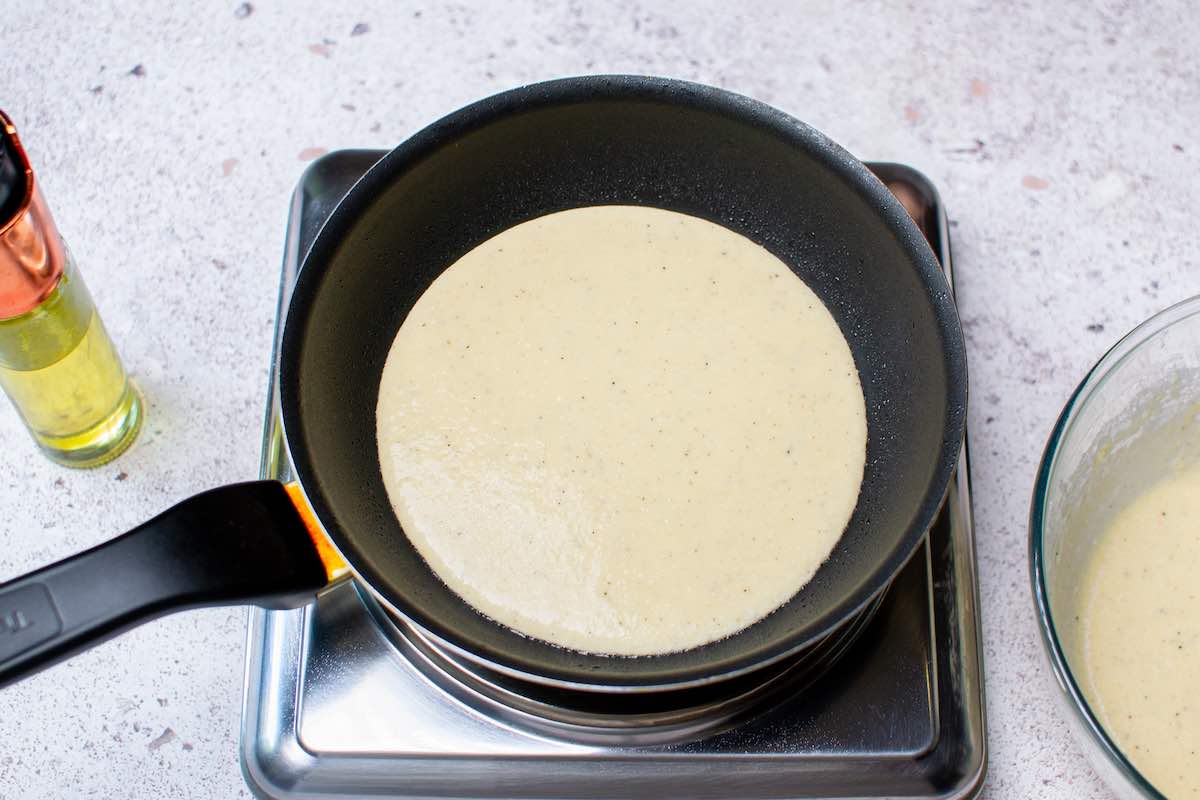 pan-frying pizza batter in a skillet.