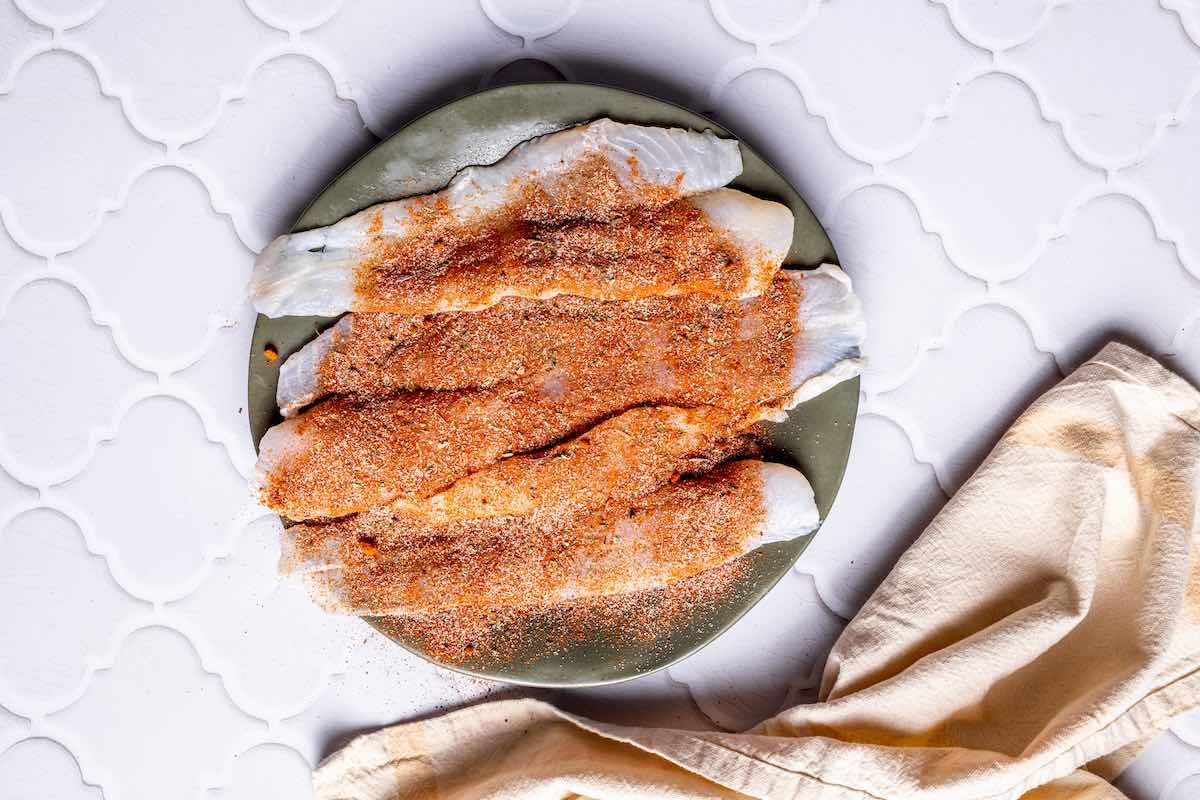 seasoned raw tilapia fillets.
