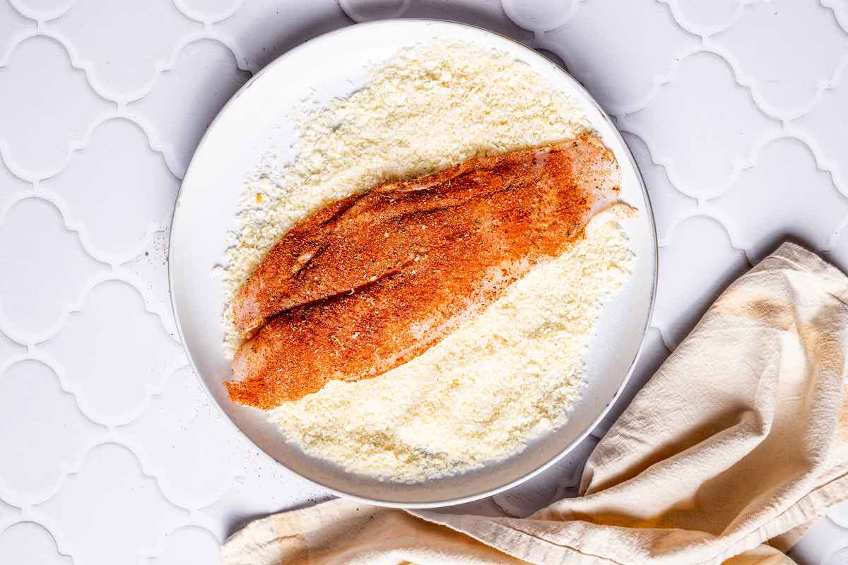 seasoned raw tilapia dipped in bread crumbs and parmesan cheese.