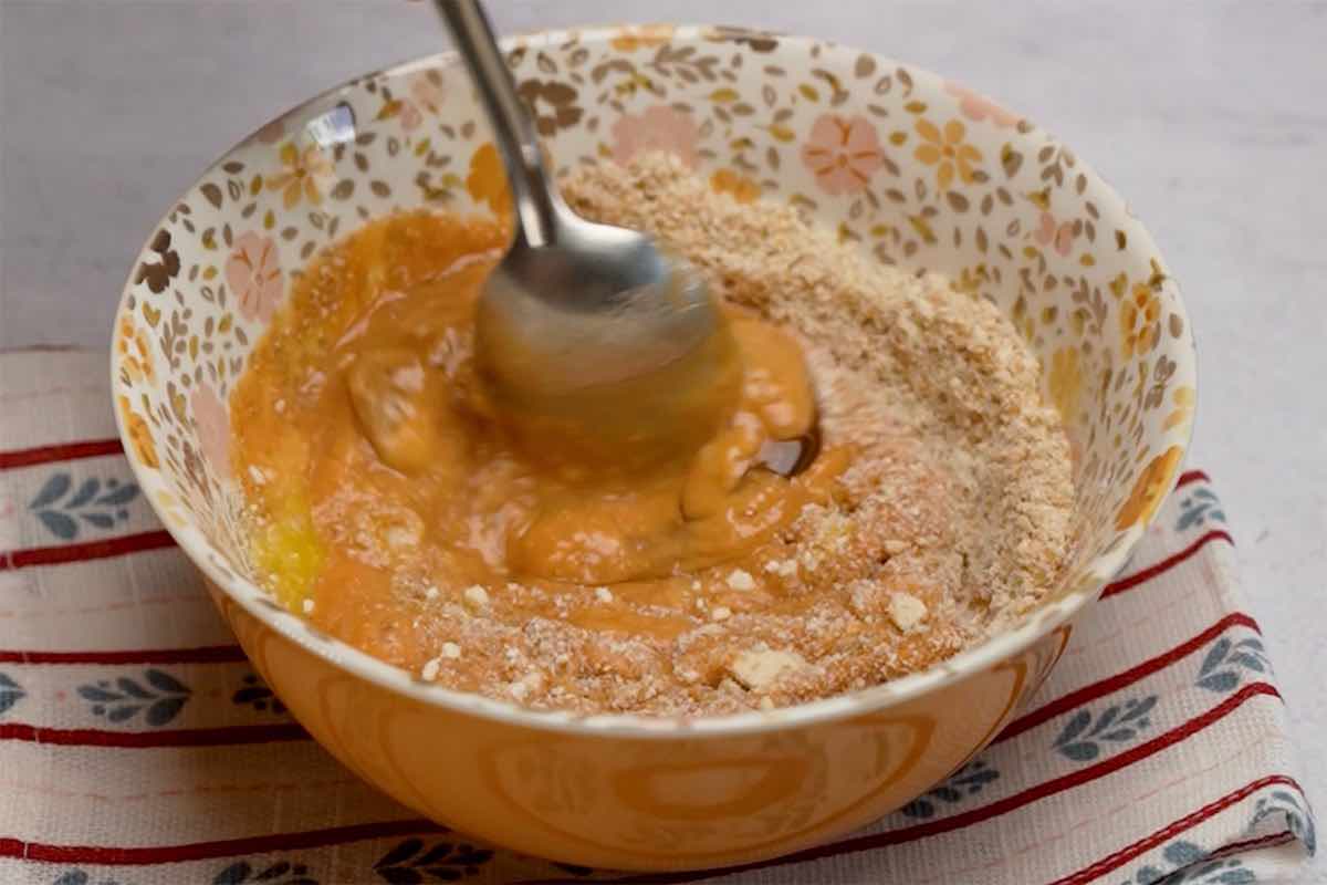 mixing mug cake ingredients in a bowl.