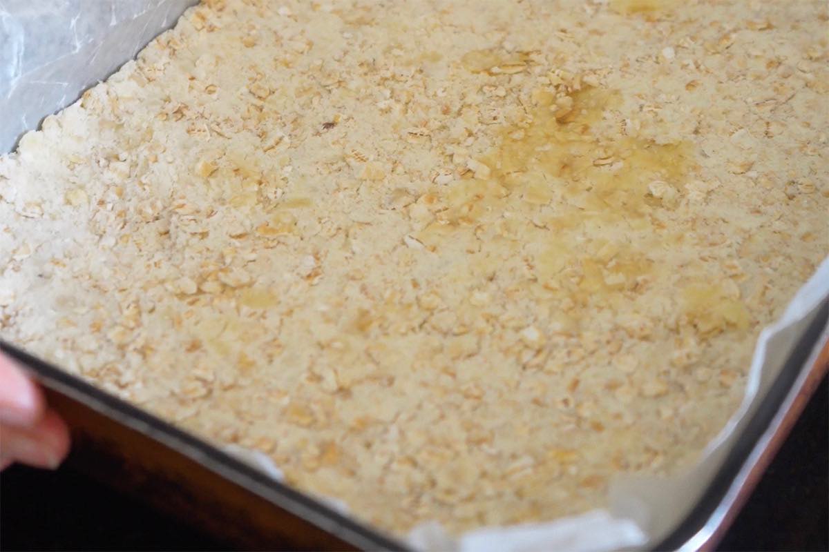 oat mixture pressed down into baking dish.