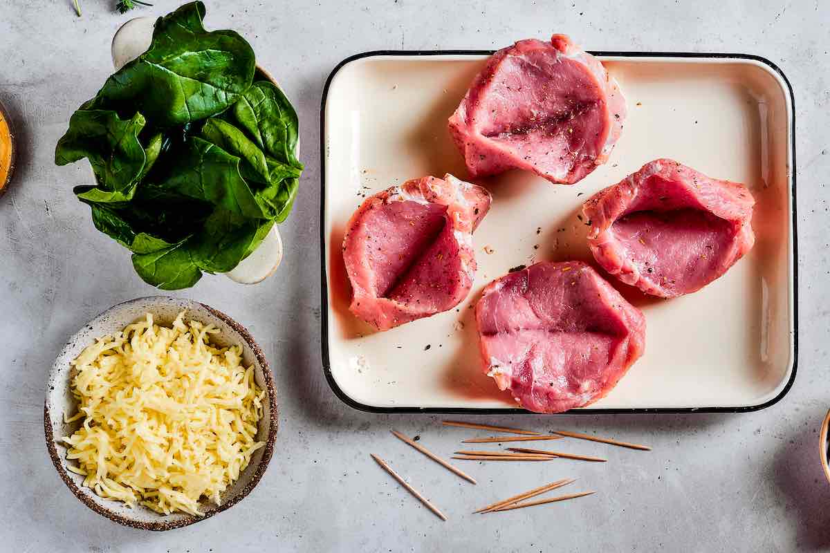 raw pork chops seasoned with salt and pepper.