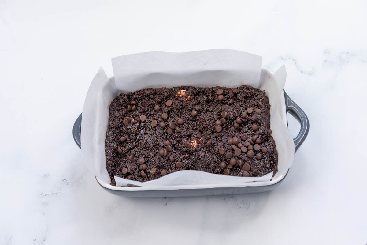 assembled vegan brownie batter in a baking dish.