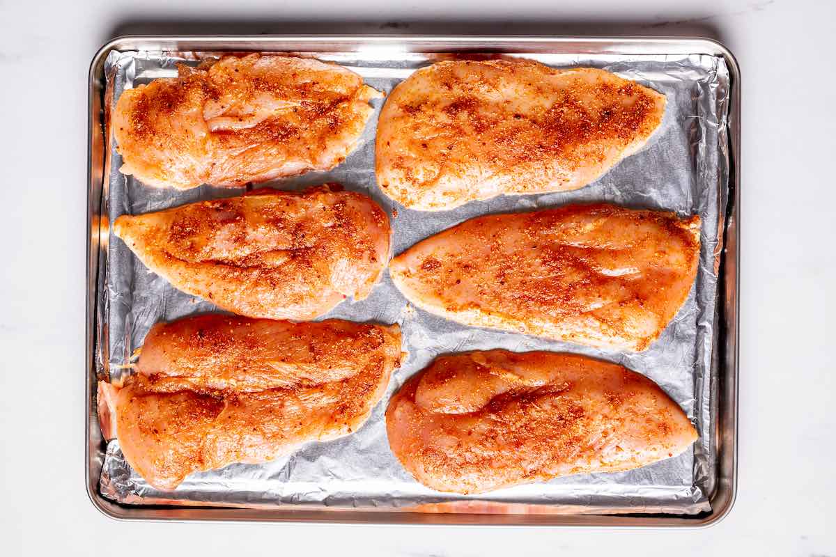 seasoned raw chicken breasts.