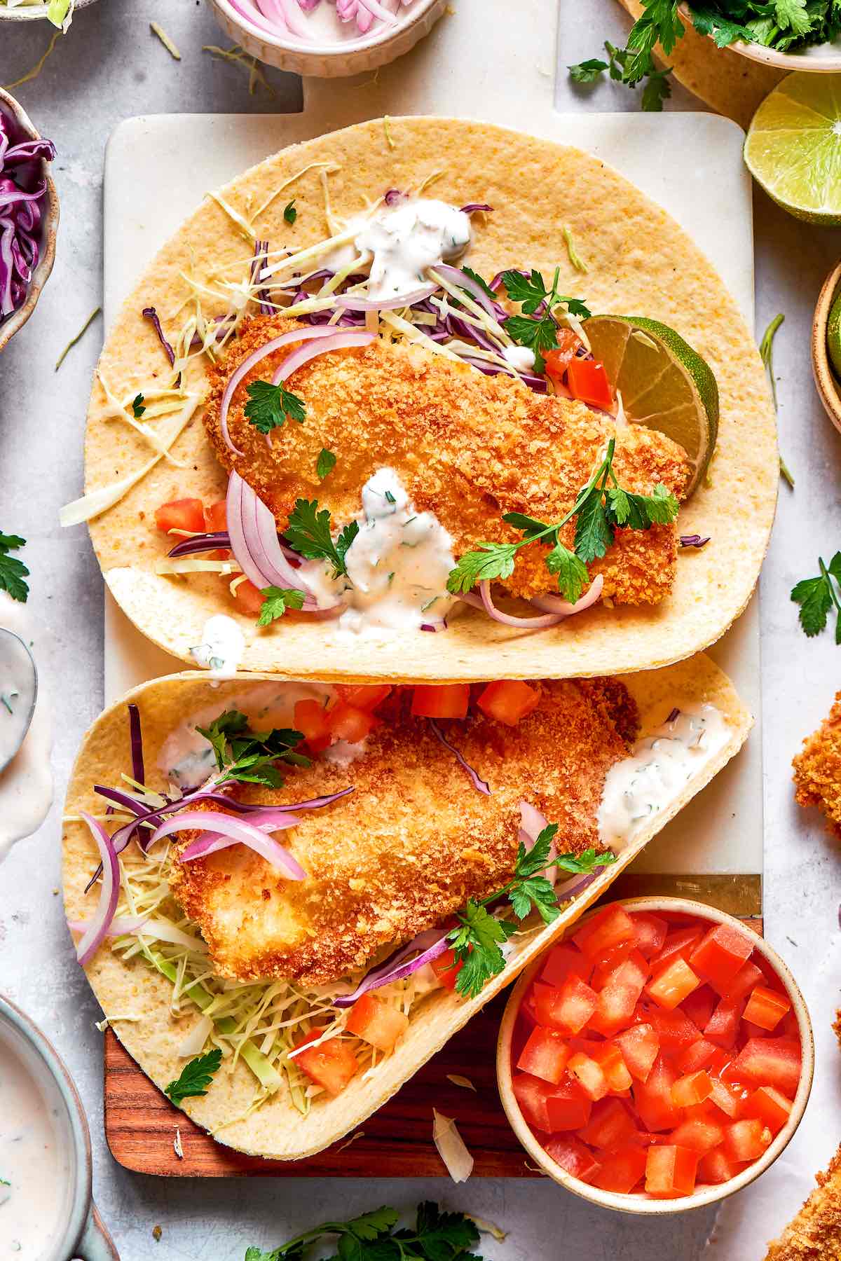crispy air fryer fish tacos with creamy sauce.