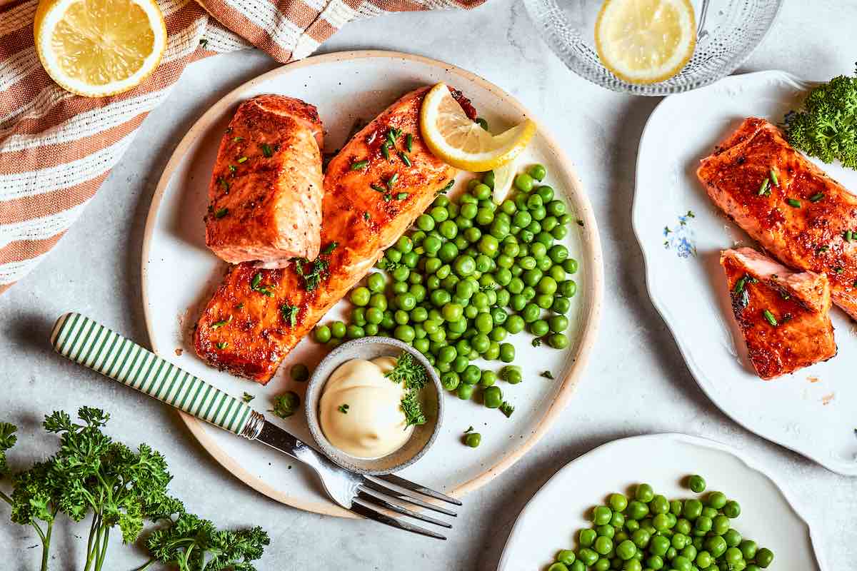 air fried frozen salmon with green peas and tartare sauce.