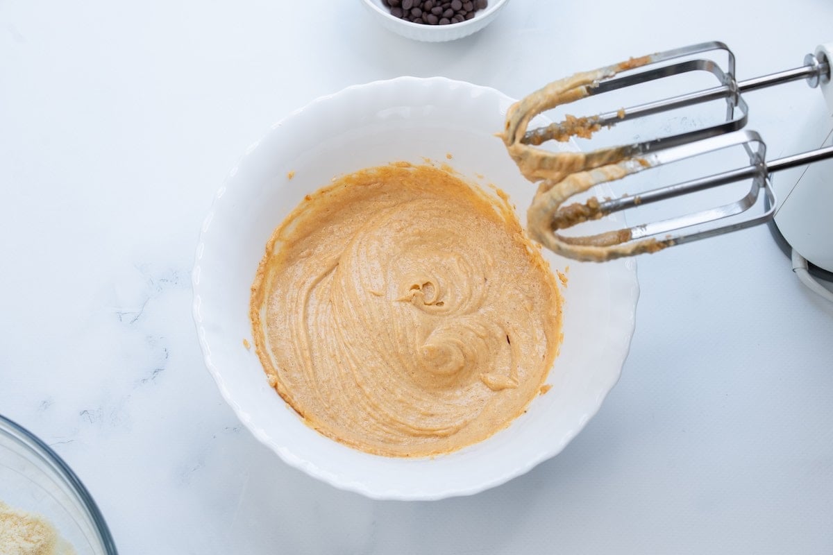 wet ingredient beaten in a white bowl.