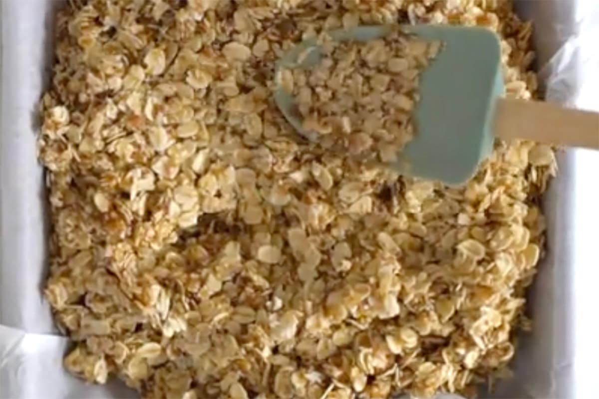 adding oat mixture in the baking dish.