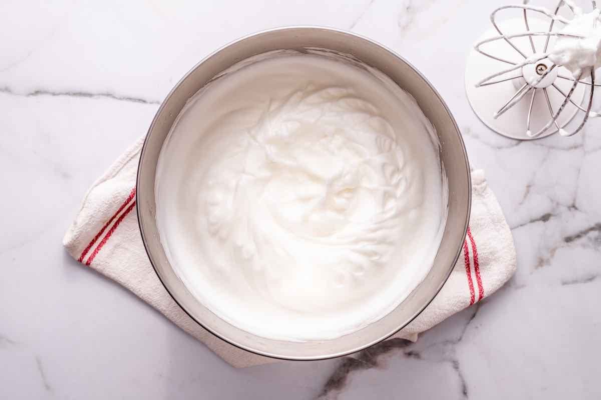 whipped egg whites in a bowl.