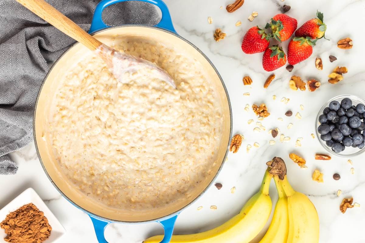 adding protein powder into cooked oatmeal.